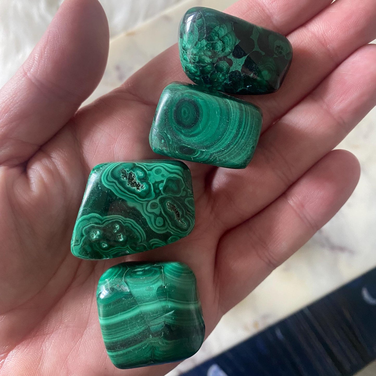 Malachite tumble stone - rich green swirling patterns