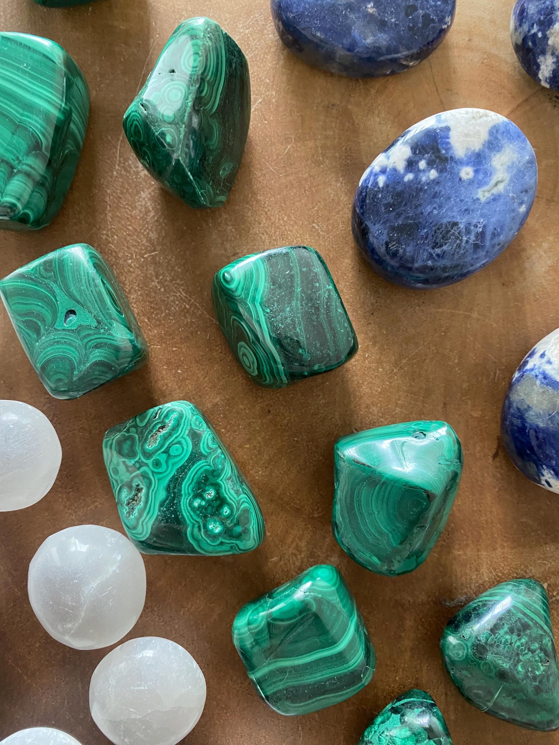 Malachite tumble stone flat lay top view